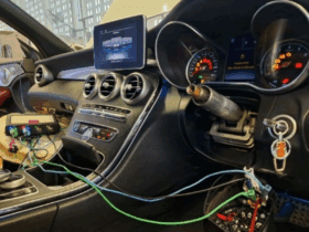 Mercedes-Benz interior showing diagnostic tools connected to the ignition and dashboard warning lights during no-start troubleshooting.